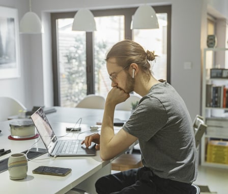 Person on laptop in home office