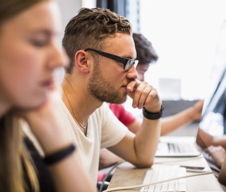 People working on computers in computer lab