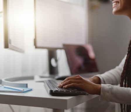 Woman working on an online coding bootcamp at home